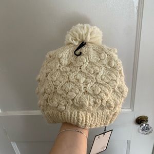 Knit white hat, with tags still on! Never worn.